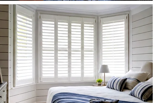 Bay window shutters in a bedroom